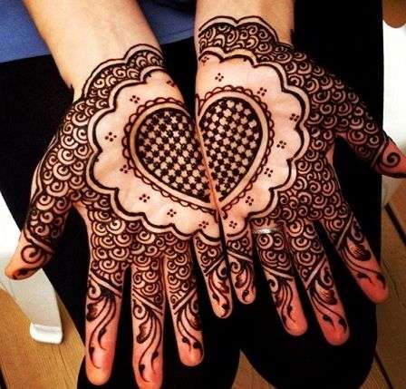 heart shape with female hands with mehndi design Stock Photo | Adobe Stock